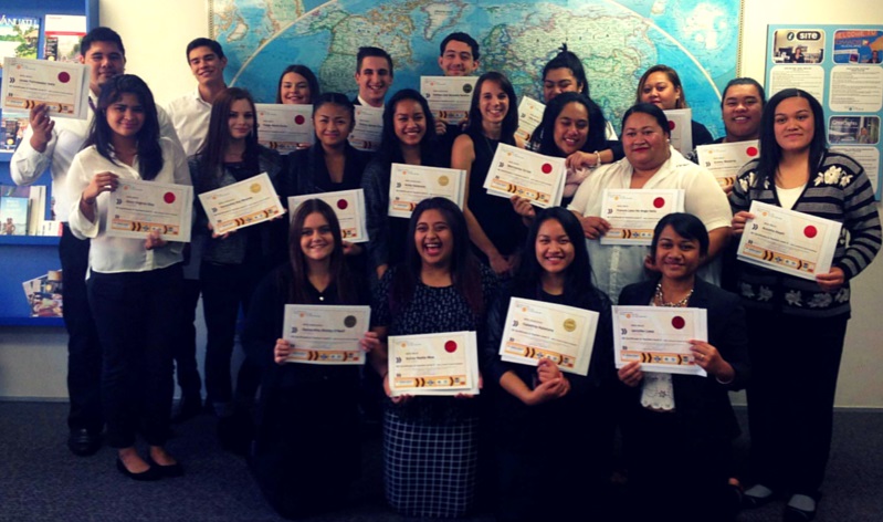 Tessa (centre) with one of her graduating classes. One of the best parts of her job is awarding each student with their qualification - hard work really does pay off!