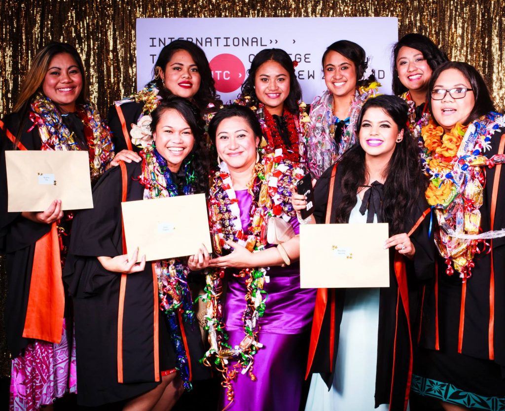 Smiling students with their certificates from last years Graduation Ceremony.