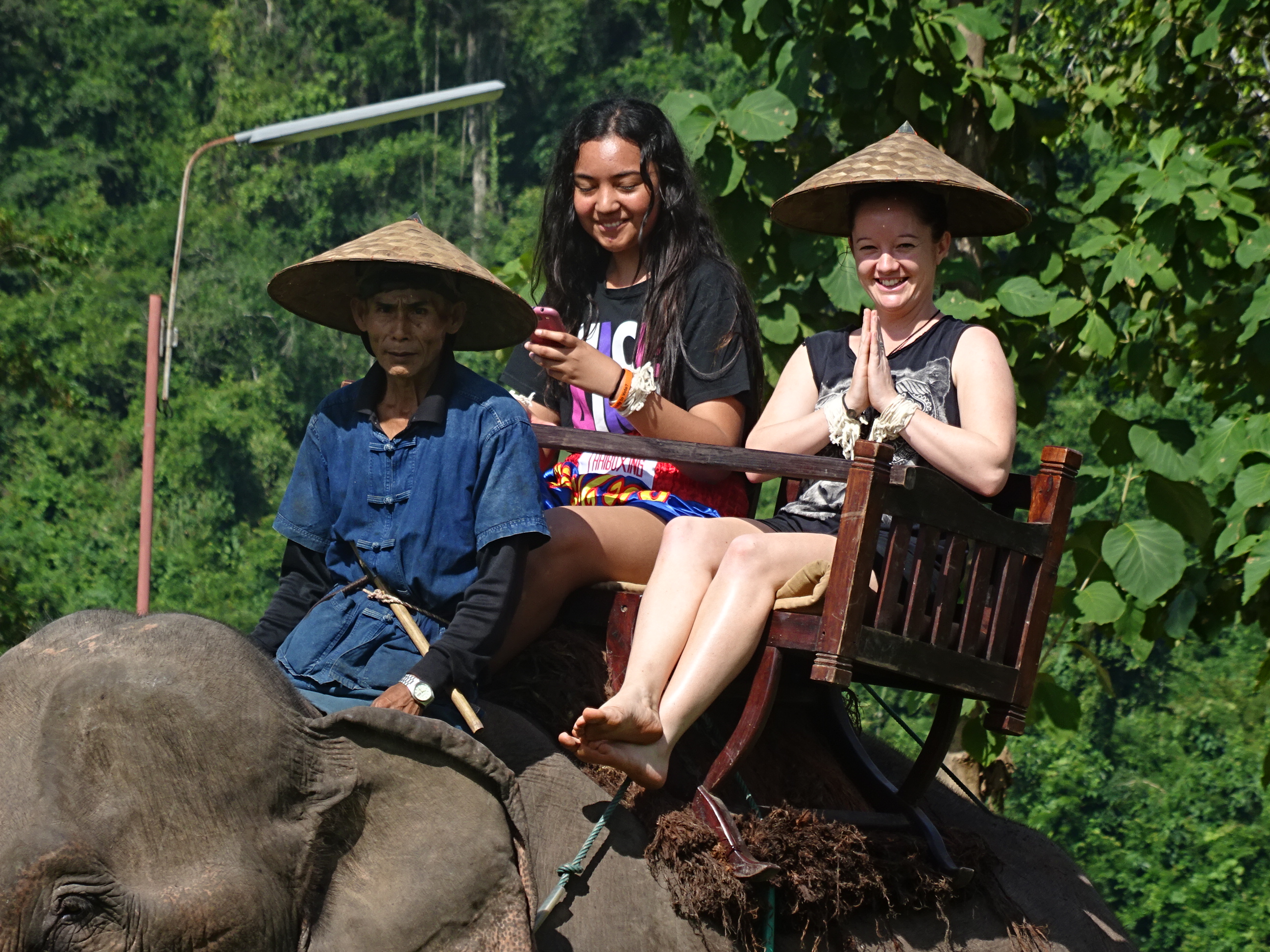 ITC's Short Course Team Leader Mel riding an elephant in Southeast Asia